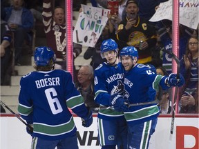 Vancouver Canucks Brock Boeser, Elias Petterson and Sven Baertschi celebrate Baertschi's goal on the Dallas Stars in the first period. Dallas would tie is 2-2 in the third before Vancouver won in the shootout.