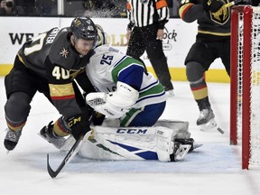Vancouver Canucks goaltender Jacob Markstrom (25) defends against Vegas Golden Knights center Ryan Carpenter (40) during the second period of an NHL hockey game Sunday, March 3, 2019, in Las Vegas.