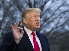 President Donald Trump speaks with the media after stepping off Marine One on the South Lawn of the White House, Sunday, March 24, 2019, in Washington. The Justice Department said Sunday that special counsel Robert Mueller's investigation did not find evidence that President Donald Trump's campaign "conspired or coordinated" with Russia to influence the 2016 presidential election.