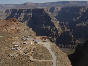 In this March 20, 2007, file photo, the Skywalk hangs over the Grand Canyon on the Hualapai Indian Reservation before its grand opening ceremony at Grand Canyon West, Ariz. (AP Photo/Ross D. Franklin, File)