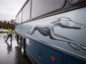 Greyhound bus driver Brent Clark, who had been with the company since 1983, does a walk-around before moving the bus to a parking lot after arriving in Whistler from Vancouver last October, one of his last trips before the bus service was eliminated in B.C.