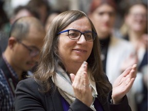 Morgane Oger applauds during an announcement at the Vancouver General Hospital in Vancouver, B.C. Friday, Nov. 16, 2018.