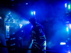 Vancouver Canucks' Troy Stecher walks on to the ice at Rogers Arena an NHL game against the New Jersey Devils in Vancouver on March 15.