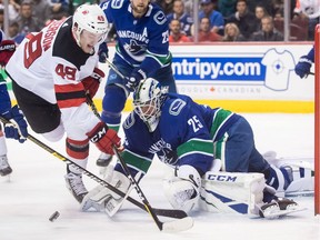Devils' Joey Anderson is stopped by Vancouver Canucks goalie Jacob Markstrom in the first period. Markstrom deserved better as he held a shutout through two periods before a couple of defensive lapses led to the shootout loss.