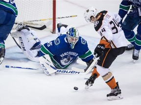 Anaheim Ducks' Sam Steel kicks the puck ahead to his stick and scores against Vancouver Canucks goalie Jacob Markstrom during the second period.