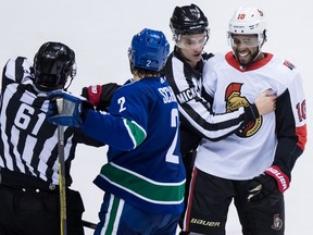 A hit by Jean-Gabriel Pageau on Canucks defenceman Ashton Sautner drew a crowd afterwards; Sautner's defence partner Luke Schenn and Senators forward Anthony Duclair were in the mix.