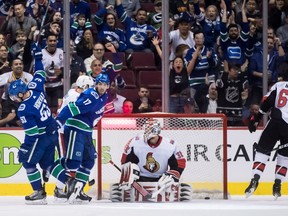 Bo Horvat celebrates his goal against Ottawa Senators goalie Anders Nilsson.