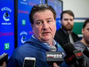 Vancouver Canucks general manager Jim Benning speaks to media during a press conference at Rogers Arena in Vancouver on March 11, 2019.