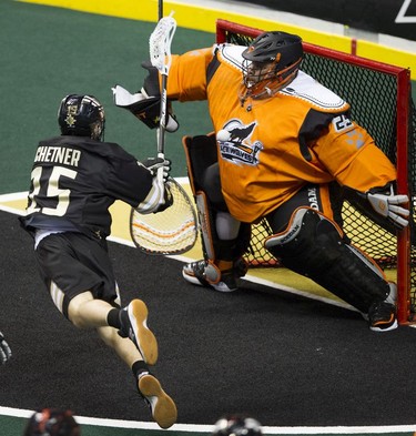 Vancouver Warriors' Jean-Luc Chetner's shot is stopped by New England Black Wolves goalie Alex Buque in their regular season National Lacrosse League game at Rogers Arena on Saturday, March 16, 2019.