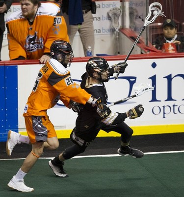 Vancouver Warriors' Tony Malcolm (right) is chased by New England Black Wolves' Jackson Nishimura in their regular season National Lacrosse League game at Rogers Arena on Saturday, March 16, 2019.