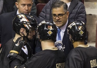 Vancouver Warriors head coach Chris Gill talks to his players during their regular season National Lacrosse League game against the New England Black Wolves at Rogers Arena on Saturday, March 16, 2019.