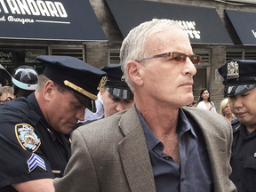 Pro-Palestinian activist Norman Finkelstein is arrested outside UN headquarters in New York, July 29, 2014, during a rally against Israeli strikes on Gaza strip.