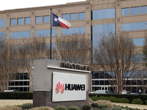 FILE - This March 7, 2019 file photo shows the Huawei Technologies Ltd. business location in Plano, Texas. The No. 2 smartphone maker in the world will be arraigned at federal court in New York on Thursday, March 14. Prosecutors have accused Huawei of using a Hong Kong front company to trade with Iran in violation of U.S. sanctions.