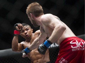 Bibiano Fernandes (left) of Brazil, who lives in Vancouver, takes on Toni Tauru of Finland during an MMA One Championship bout in Yangon, Myanmar, in July 2015.