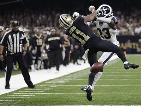 Saints wide receiver Tommylee Lewis (left) works for a catch against Rams defensive back Nickell Robey-Coleman (right) during the NFC Championship game in New Orleans on Jan. 20, 2019.