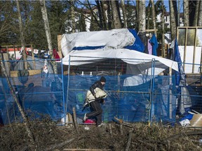 Maple Ridge city officials with local fire and RCMP moved in to dismantle Anita's Place homeless camp on Saturday.