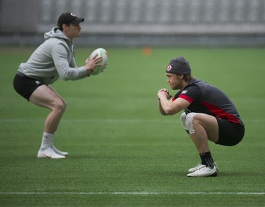 Team Canada's Jake Thiel (right) practices with the rest of the team at BC Place stadium in Vancouver, B.C., Wednesday, March 6, 2019 for the upcoming HSBC Canada Sevens Rugby series.