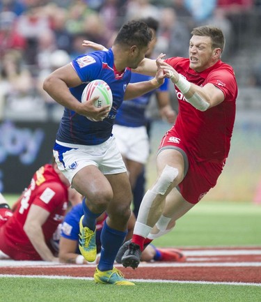Canada's Adam Zaruba chases down a player from Samoa at BC Place Stadium during the 2019 HSBC Canada Sevens rugby tournament in Vancouver, Saturday, March 9, 2019.