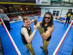 New Westminster Mayor Jonathan Coté (left) teams up with Mr. India in a tag-team match on March 30.