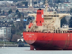 Bulk carrier Pan Acacia on the water with North Vancouver in the background.