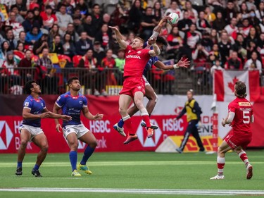 Canada's Connor Braid (6) jumps for the ball against Samoa's Elisapeta Alofipo (10) during World Rugby Sevens Series action in Vancouver, B.C., on Saturday March 9, 2019.
