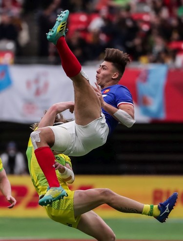 France's Antoine Zeghdar (11) jumps for the ball against Australia's Ben O'Donnell (5) during World Rugby Sevens Series action in Vancouver, B.C., on Saturday March 9, 2019.
