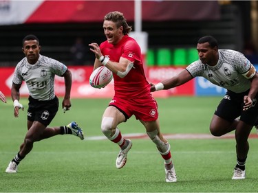 Luke McCloskey of Canada runs the ball against Fiji during Saturday's World Rugby Sevens Series action at B.C. Place Stadium in Vancouver. Canada upset the 2016 Olympic gold medallists 26-19.