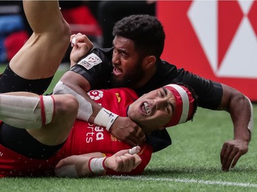 Spain's Joan Losada (9) is tackled by New Zealand's Vilimoni Koroi (6) during World Rugby Sevens Series action in Vancouver, B.C., on Saturday, March 9, 2019.