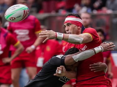 Spain's Joan Losada (9) is tackled by New Zealand's Vilimoni Koroi (6) during World Rugby Sevens Series action in Vancouver, B.C., on Saturday, March 9, 2019.