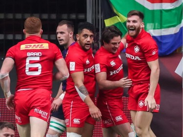 Canada's Connor Braid (No. 6) celebrates his game-winning try with delighted teammates against Scotland during World Rugby Sevens Series action in Vancouver on Sunday, March 10, 2019.