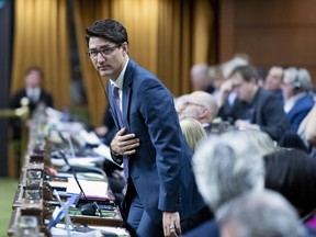 Prime Minister Justin Trudeau rises to vote during a marathon voting session in the House of Commons in Ottawa on Wednesday, March 20, 2019.