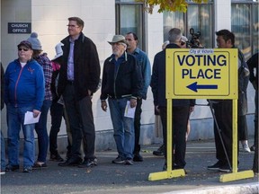 People wait in line to vote for Victoria's mayor and council at the polling station in Central Baptist Church during the October 2018 municipal election. Photograph by Darren Stone, Victoria Times Colonist