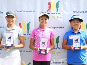 Anna Jiaxin Huang of Vancouver, right, poses with Claire Chang, left, and Michelle Woo after finishing in the top three overall in the girls' 10-11 competition during The Drive, Chip and Putt Championship at Chambers Bay on Sept. 9, 2018 in University Place, Washington.