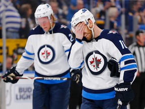 ST. LOUIS, MO - APRIL 20: Bryan Little #18 of the Winnipeg Jets reacts after the Jets were eliminated in Game Six of the Western Conference First Round during the 2019 NHL Stanley Cup Playoffs at the Enterprise Center on April 20, 2019 in St. Louis, Missouri. (Photo by Dilip Vishwanat/Getty Images) ORG XMIT: 775325909