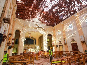 Sri Lankan officials inspect St. Sebastian's Church in Negombo, north of Colombo, after multiple explosions targeting churches and hotels across Sri Lanka on April 21, 2019, in Negombo, Sri Lanka. More than 200 people were killed and hundreds more injured after multiple explosions rocked three churches and three luxury hotels in and around Colombo as well as at Batticaloa in Sri Lanka during Easter Sunday mass.