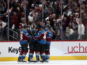 Cale Makar of the Colorado Avalanche celebrates with his teammates after scoring a goal in the first period against the Calgary Flames in Game Three of the Western Conference First Round during the 2019 NHL Stanley Cup Playoffs at the Pepsi Center on April 15, 2019 in Denver, Colorado.