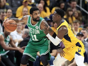 Kyrie Irving of the Boston Celtics dribbles the ball against the Indiana Pacers in Game 4 of their first-round NBA playoff series at Bankers Life Fieldhouse on April 21, 2019 in Indianapolis.