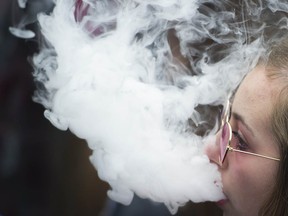 A woman exhales at the annual 4/20 protest, Sunset Beach, Vancouver.