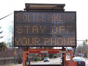 A distracted driving warning sign on the North Shore.