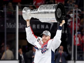 Lars Eller hoists the Stanley Cup after his team's 4-3 win over the Vegas Golden Knights in Game 5 of the best-of-seven series at T-Mobile Arena in Las Vegas on June 7, 2018.