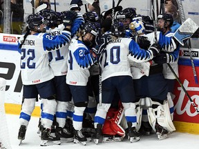 Players of Team Finland react after winning against Team Canada 2-4 during the IIHF Women's Ice Hockey World Championships semifinal match Canada vs Finland in Espoo, Finland on April 13, 2019. (Photo by Jussi Nukari / Lehtikuva / AFP) / Finland OUTJUSSI NUKARI/AFP/Getty Images
