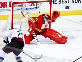 Colorado Avalanche Nathan MacKinnon with overtime winner against Mike Smith of the Calgary Flames in game two of the Western Conference First Round during the 2019 NHL Stanley Cup Playoffs at the Scotiabank Saddledome in Calgary on Saturday, April 13, 2019. Al Charest/Postmedia