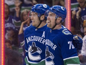 Tanner Pearson (right) celebrates one of his two goals against San Jose on April 2 with linemate Bo Horvat.