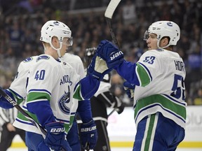 There’s no more riddle down the middle — at least in the top two spots — for the Vancouver Canucks, as rookie Elias Pettersson (left) and fifth-year NHLer Bo Horvat proved to be foundational players for the club in 2018-19.