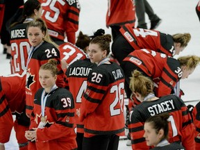 Canadian players react after their IIHF Women's Ice Hockey World Championships bronze medal match against Russia, a 7-0 victory, in Espoo, Finland, on Sunday, April 14, 2019.