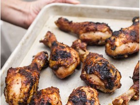 A pan of Grill-Roasted Spice-Rubbed Chicken Drumsticks.