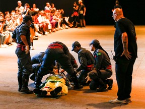 Model Tales Soares faints at the runway and is aided by firefighters during the Ocksa fashion show during Sao Paulo Fashion Week at Arca on April 27, 2019 in Sao Paulo, Brazil. (Alexandre Schneider/Getty Images)
