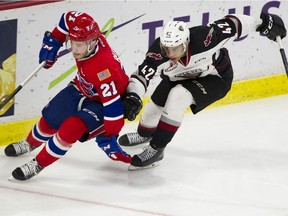 Justin Sourdif of the Vancouver Giants, who just turned 17, chases after Bobby Russell of the Spokane Chiefs in Game 2 of the WHL Western Conference Final series at Langley Events Centre.