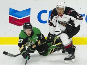 Justin Sourdif of the Vancouver Giants, right, gets tangled up with Parker Kelly of the Prince Albert Raiders when the teams met earlier this season at Langley Events Centre. Both teams open the best-of-seven WHL Final series on Friday in Prince Alberta, Sask.