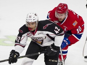 Vancouver Giants' Justin Sourdif is pursued by Spokane Chiefs' Ethan McIndoe in Game 5 of the WHL Western Conference Championship at the Langley Events Centre on April 26.